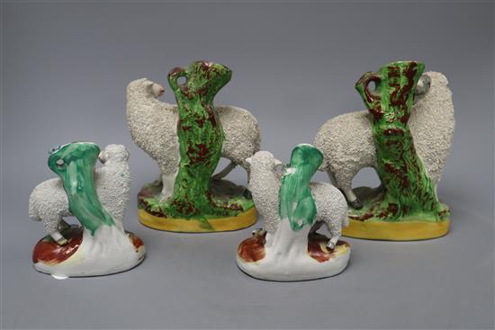 Two pairs of Staffordshire sheep, tallest 18cm